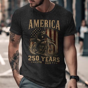 Dark t-shirt with American flag, a skeleton on a motorcycle, and "America 250 Years" text.