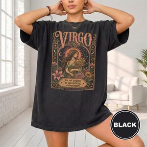 Black t-shirt with "VIRGO" and astrological artwork titled "I'm not judging. I'm just noticing... professionally."
