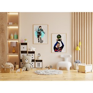 May include: Two framed posters of a soccer player in a blue and white jersey holding a soccer ball and a soccer player in a red and blue jersey holding a trophy.