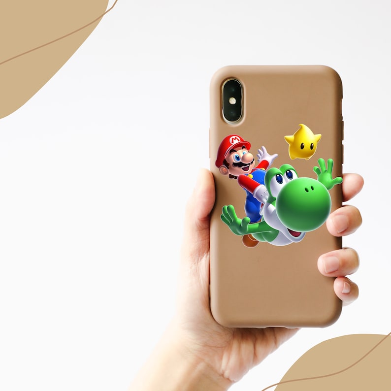 May include: A brown phone case with a graphic of Mario and Yoshi from the Super Mario Bros. video game series. The graphic shows Mario riding Yoshi, who is green with a yellow star in the background.