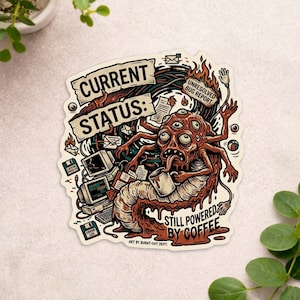 May include: A die-cut sticker featuring a multi-eyed, multi-armed creature holding a coffee mug. The text reads CURRENT STATUS: UNRESOLVED BUG REPORT and STILL POWERED BY COFFEE. It includes illustrations of computers, floppy disks, and flames.