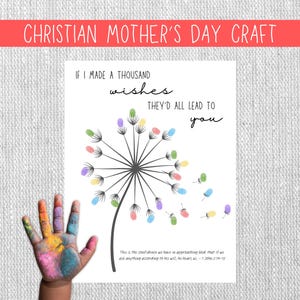 Puede incluir: Una impresión blanca con el texto "CHRISTIAN MOTHER'S DAY CRAFT" y "IF I MADE A THOUSAND wishes THEY'D ALL LEAD TO you". La impresión presenta un diente de león con huellas dactilares coloridas. Una mano pintada está en la imagen.