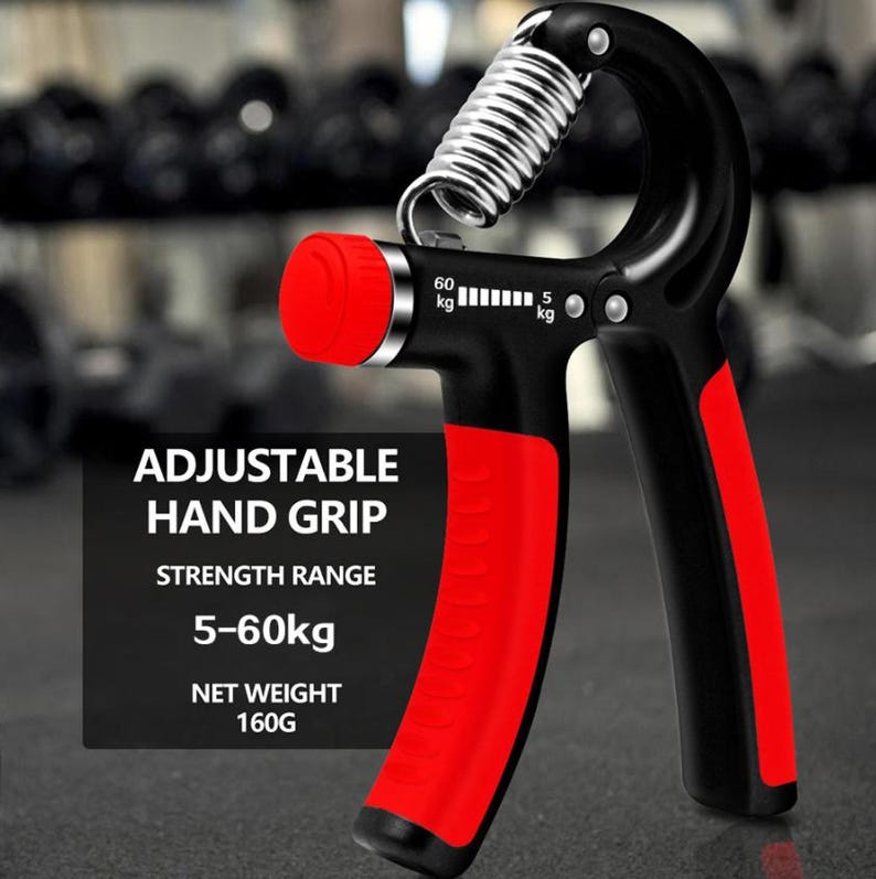 Puede incluir: Empu&ntilde;adura de mano ajustable negra y roja con un resorte plateado. El agarre tiene un rango de fuerza de 5-60 kg y un peso neto de 160 g. El texto "ADJUSTABLE HAND GRIP" es visible.