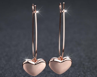 Boucles d'oreilles élégantes et lisses en forme de coeur pour femme