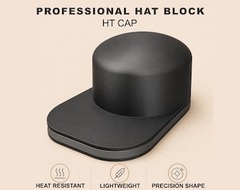 Pode incluir: Um bloco de chapéu HT Cap preto com uma base plana e um topo arredondado. A imagem inclui o texto "PROFESSIONAL HAT BLOCK HT CAP" e "HEAT RESISTANT", "LIGHTWEIGHT" e "PRECISION SHAPE". O produto é projetado para chapeleiros modernos.
