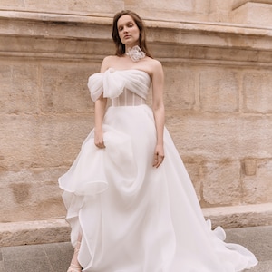 Elegant A-line organza wedding dress ,With delicate  sheer corset. Modern  wedding dress with. Minimalist design and a sheer corset.