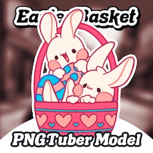 May include: Two white bunnies with pink cheeks are sitting in a pink and blue Easter basket with hearts and blue trim. The basket is filled with blue and white Easter eggs. The text "Easter Basket" is above the basket.