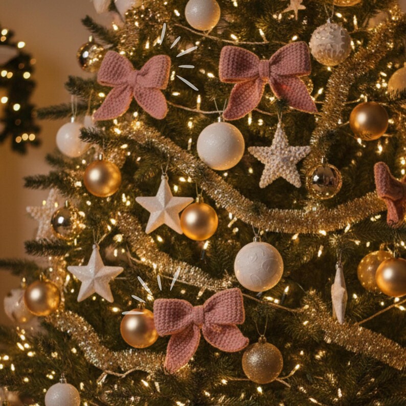 May include: A decorated Christmas tree with warm white lights, gold tinsel, and various ornaments. The ornaments include white and gold baubles, star-shaped decorations, and pink knitted bows. The tree is a festive display.