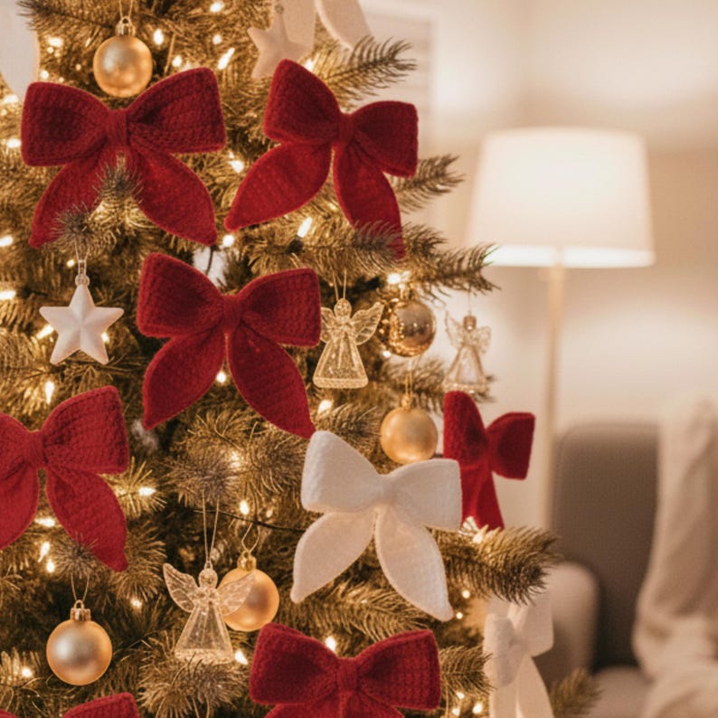 May include: A decorated Christmas tree with red and white knitted bows, gold ornaments, star and angel decorations, and warm white lights. The tree is in a cozy, well-lit room.