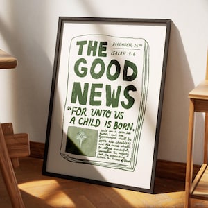 Peut inclure: Une impression encadrée avec un design de journal vintage. Le titre principal est "The Good News" avec le texte "For unto us a child is born." et une référence à Isaïe 9:6. L'impression est dans des tons de vert sur un fond blanc.