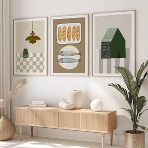 May include: Three framed prints with a minimalist design. The first print features a chequered pattern and a hanging light fixture. The second print shows a plate of bread and a plate of fish. The third print has a house with the text "As for me and my house, we will serve the Lord."