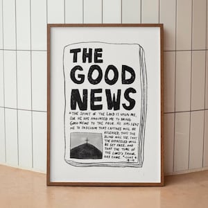 May include: A black and white print of a newspaper headline that reads "The Good News". The text below the headline is a bible verse from Luke 4:18-19, "The Spirit of the Lord is upon me, for he has anointed me to bring good news to the poor. He has sent me to proclaim that captives will be released, that the blind will see, that the oppressed will be set free, and that the time of the Lord's favor has come."