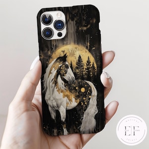 May include: A black iPhone case with a white horse standing in a forest with a full moon in the background. The horse has gold and white markings. The case has a camera lens cutout.