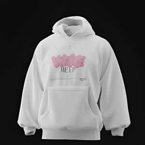 May include: White hoodie with a pink "WAKE ME UP" graphic on the front. The hoodie has a kangaroo pocket and a drawstring hood.