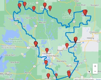 May include: A map of a region in Minnesota showing a blue line outlining a route. The route is marked with red dots. The map includes the names of towns, rivers, and lakes.