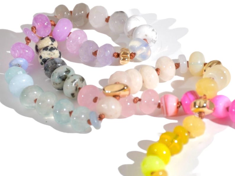 Candy Colored Long Beaded Gem Necklace featuring neon colored rainbow gemstones and opal rainbow beads. 
 It is a beautiful Boho Chic Statement Necklace for the Summer in colors of bright neon pinks , purples, oranges, pastels and yellows.