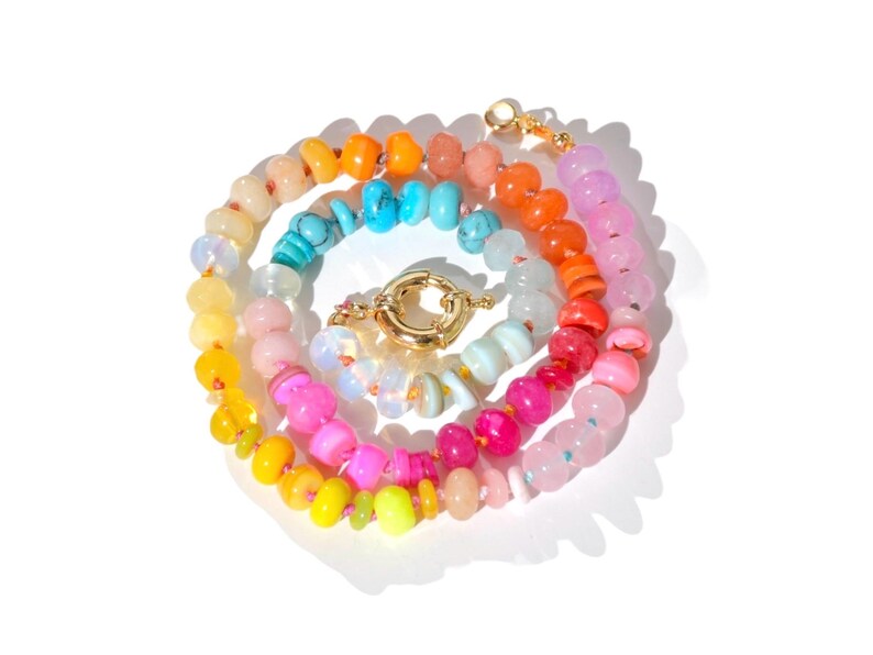 Candy Colored Long Beaded Gem Necklace featuring neon colored rainbow gemstones opal rainbow beads. 
 It is a beautiful Boho Chic Statement Necklace for the Summer in colors of bright neon pinks , purples, oranges, turquoise and yellows.