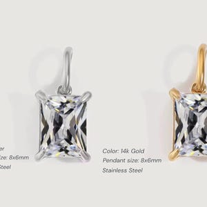 Gold diamond crystal charm displayed on a white background, each featuring a baguette cut The clear faceted stones shimmer in the light, framed in gold settings with looped bails for attaching to necklaces or bracelets. Elegant minimalist photo showing jewelry-making pendants available in both gold and silver options.  Perfect for diy jewelry to use as add-on charms for any charm necklace or charm bracelet.