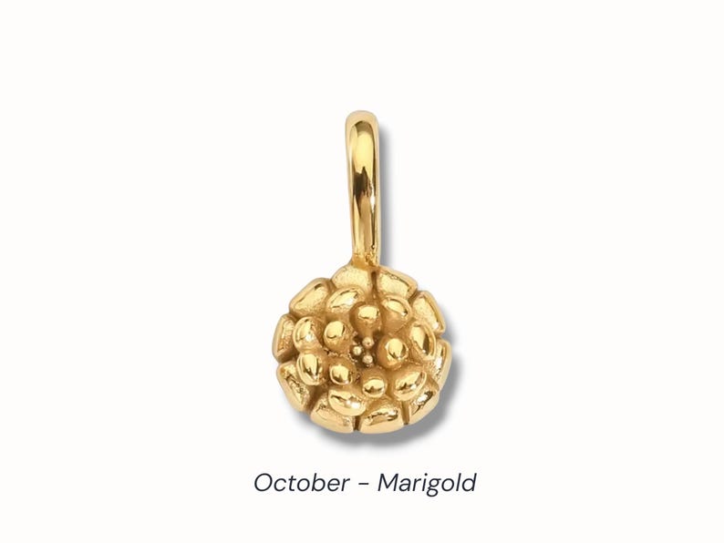 Gold birth flower charm representing each month, featuring a delicate embossed floral design on a round gold pendant — a personalized jewelry gift for her.