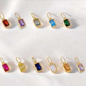Gold birthstone charms featuring bezel-set gemstones for each month, designed for custom necklaces and bracelets.  14k gold vermeil 925 Sterling silver