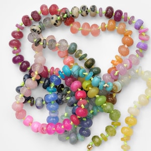 A rainbow multi-gemstone necklace that is handknotted   & handcrafted.  Made from natural semi precious gemstones.  This necklace is sure to add a pop of color to any outfit