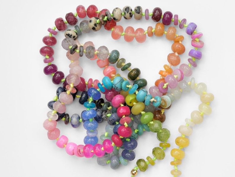 A rainbow multi-gemstone necklace that is handknotted   & handcrafted.  Made from natural semi precious gemstones.  This necklace is sure to add a pop of color to any outfit