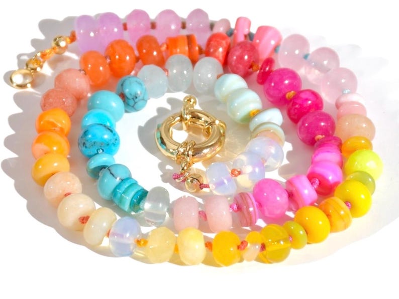Candy Colored Long Beaded Gem Necklace featuring neon colored rainbow gemstones opal rainbow beads. 
 It is a beautiful Boho Chic Statement Necklace for the Summer in colors of bright neon pinks , purples, oranges, turquoise and yellows.