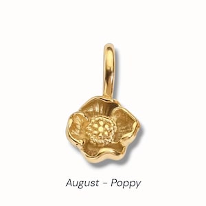 Gold birth flower charm representing each month, featuring a delicate embossed floral design on a round gold pendant — a personalized jewelry gift for her.