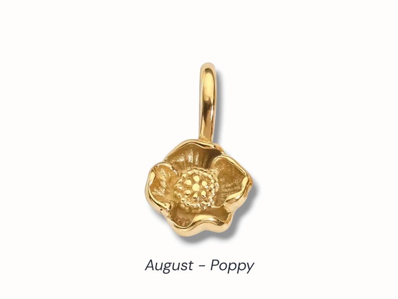 Gold birth flower charm representing each month, featuring a delicate embossed floral design on a round gold pendant — a personalized jewelry gift for her.