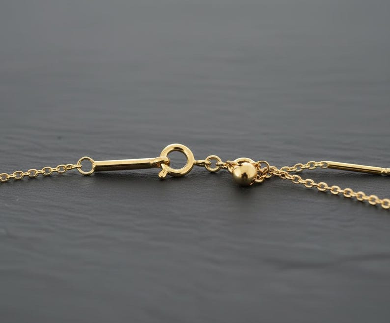 14k gold chain threader necklace with delicate bar needle. minimalist jewelry for her. close up of threader needle