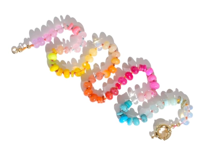 Candy Colored Long Beaded Gem Necklace featuring neon colored rainbow gemstones opal rainbow beads. 
 It is a beautiful Boho Chic Statement Necklace for the Summer in colors of bright neon pinks , purples, oranges, turquoise and yellows.