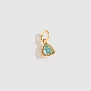 14k gold vermeil birthstone charms in a triangular bezel setting, each featuring a different colored gemstone, arranged neatly on a white background. Designed for necklaces and bracelets.