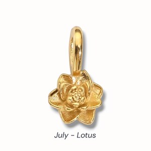 Gold birth flower charm representing each month, featuring a delicate embossed floral design on a round gold pendant — a personalized jewelry gift for her.