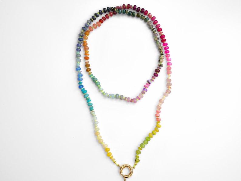 A rainbow multi-gemstone necklace that is handknotted   & handcrafted.  Made from natural semi precious gemstones.  This necklace is sure to add a pop of color to any outfit