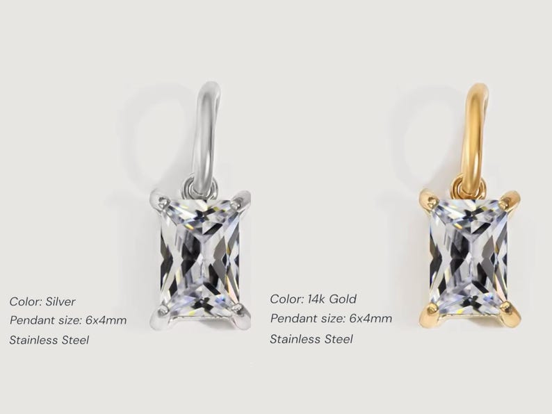 Gold diamond crystal charm displayed on a white background, each featuring a baguette cut The clear faceted stones shimmer in the light, framed in gold settings with looped bails for attaching to necklaces or bracelets. Elegant minimalist photo showing jewelry-making pendants available in both gold and silver options.  Perfect for diy jewelry to use as add-on charms for any charm necklace or charm bracelet.