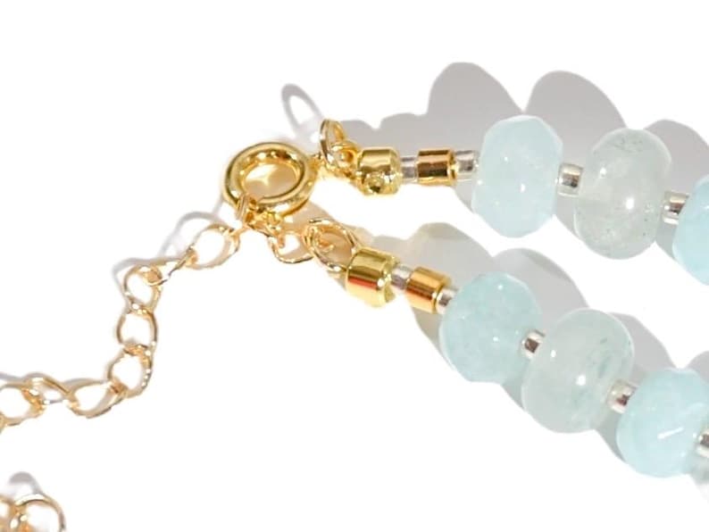 Light blue aquamarine Gem Necklace hand made with silver and gold spacer beads. 
 It is a beautiful Boho Chic Statement Necklace for the Summer in colors of soft  blue.