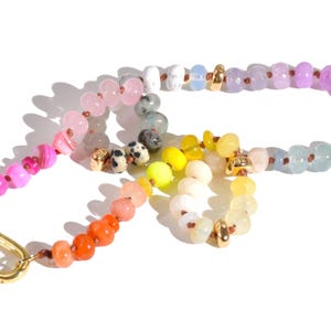 Candy Colored Long Beaded Gem Necklace featuring neon colored rainbow gemstones and opal rainbow beads. 
 It is a beautiful Boho Chic Statement Necklace for the Summer in colors of bright neon pinks , purples, oranges, pastels and yellows.