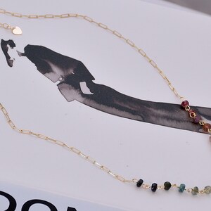 Gorgeous rainbow tourmaline rondelle beaded necklace that is wire wrapped toa 14k gold filled paperclip chain.  Handmade and handcrafted natural gems