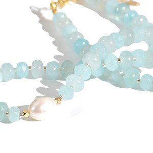 Light blue aquamarine Gem Necklace hand made with silver and gold spacer beads. 
 It is a beautiful Boho Chic Statement Necklace for the Summer in colors of soft  blue.