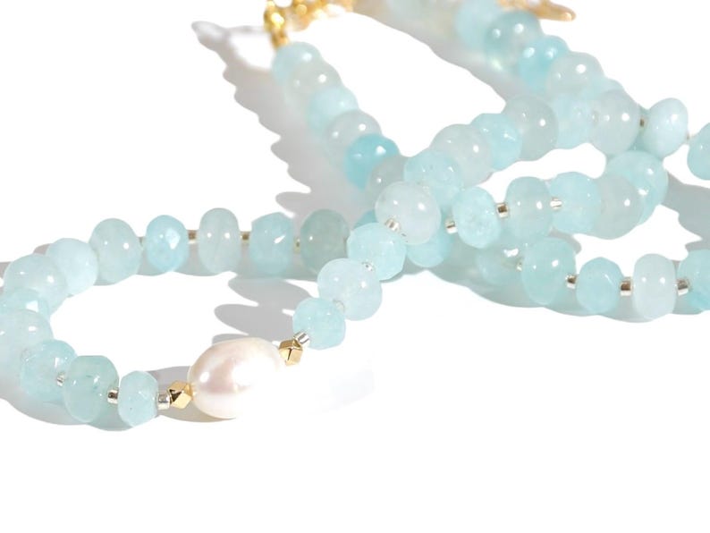 Light blue aquamarine Gem Necklace hand made with silver and gold spacer beads. 
 It is a beautiful Boho Chic Statement Necklace for the Summer in colors of soft  blue.
