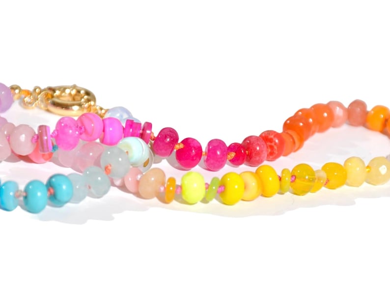 Candy Colored Long Beaded Gem Necklace featuring neon colored rainbow gemstones opal rainbow beads. 
 It is a beautiful Boho Chic Statement Necklace for the Summer in colors of bright neon pinks , purples, oranges, turquoise and yellows.
