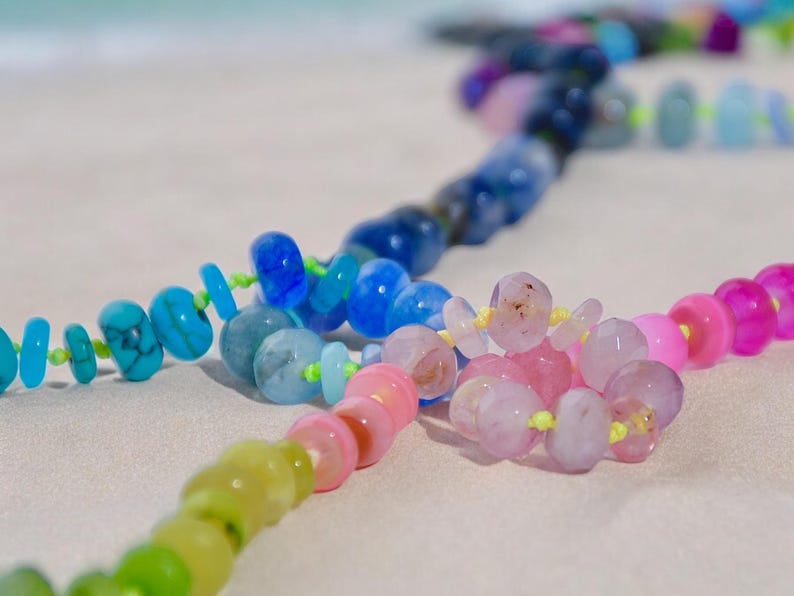 A rainbow multi-gemstone necklace that is handknotted   & handcrafted.  Made from natural semi precious gemstones.  This necklace is sure to add a pop of color to any outfit