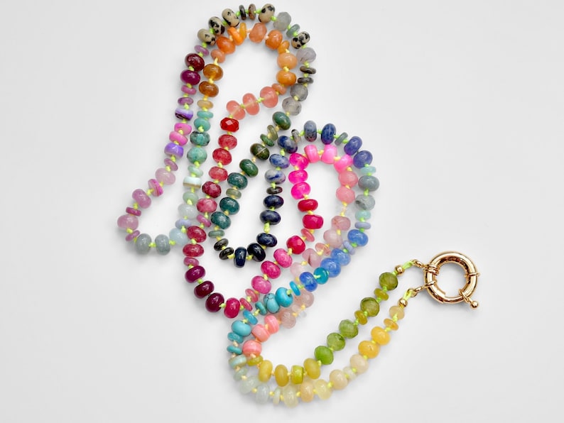 A rainbow multi-gemstone necklace that is handknotted   & handcrafted.  Made from natural semi precious gemstones.  This necklace is sure to add a pop of color to any outfit
