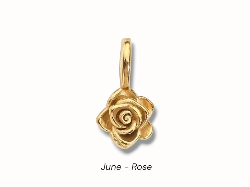Gold birth flower charm representing each month, featuring a delicate embossed floral design on a round gold pendant — a personalized jewelry gift for her.