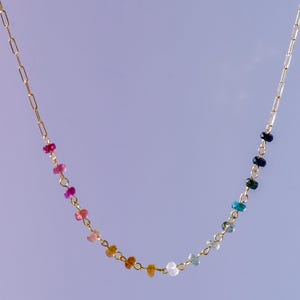 Gorgeous rainbow tourmaline rondelle beaded necklace that is wire wrapped toa 14k gold filled paperclip chain.  Handmade and handcrafted natural gems