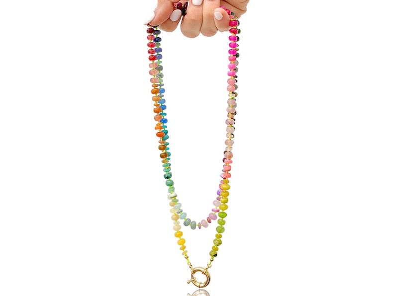 A rainbow multi-gemstone necklace that is handknotted   & handcrafted.  Made from natural semi precious gemstones.  This necklace is sure to add a pop of color to any outfit