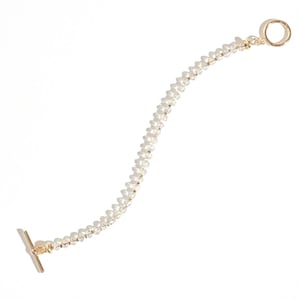 May include: A gold chain bracelet with small white beads. The bracelet has a t-bar clasp and a circular clasp.