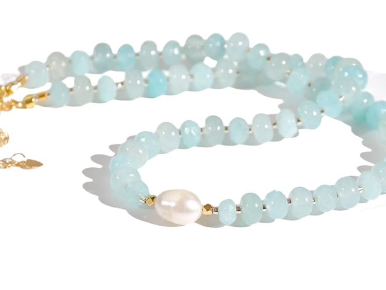 Light blue aquamarine Gem Necklace hand made with silver and gold spacer beads. 
 It is a beautiful Boho Chic Statement Necklace for the Summer in colors of soft  blue.