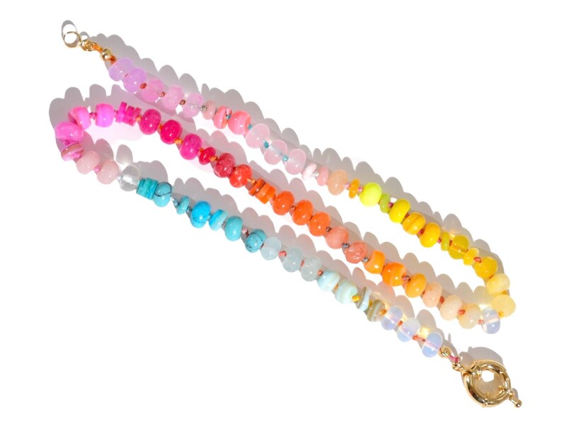 Candy Colored Long Beaded Gem Necklace featuring neon colored rainbow gemstones opal rainbow beads. 
 It is a beautiful Boho Chic Statement Necklace for the Summer in colors of bright neon pinks , purples, oranges, turquoise and yellows.