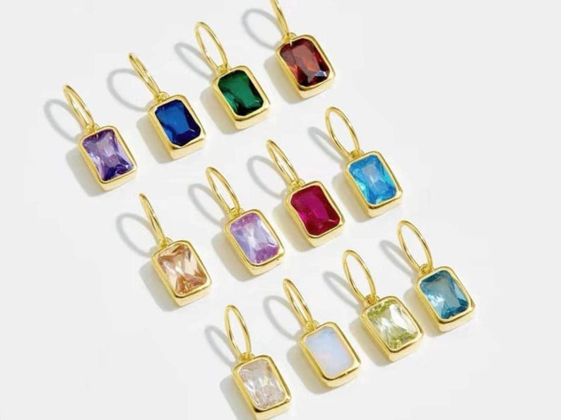 Gold birthstone charms featuring bezel-set gemstones for each month, designed for custom necklaces and bracelets.  14k gold vermeil 925 Sterling silver